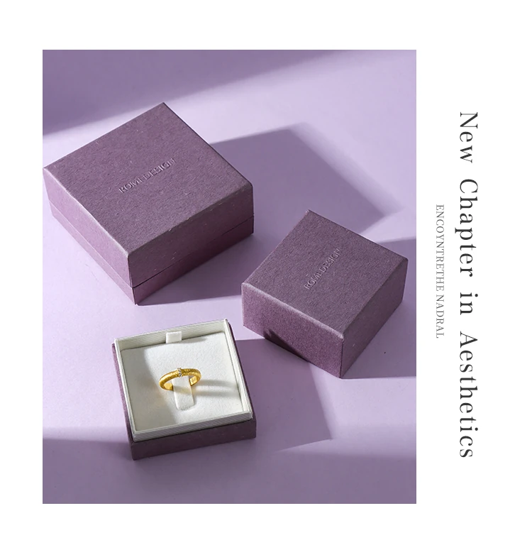 Custom purple jewelry box 3 piece aesthetic ring — 2 closed and 1 open box with gold ring on velvet interior. Custom jewelry boxes with velvet interior for jewelry retailers, specialty paper jewelry packaging.